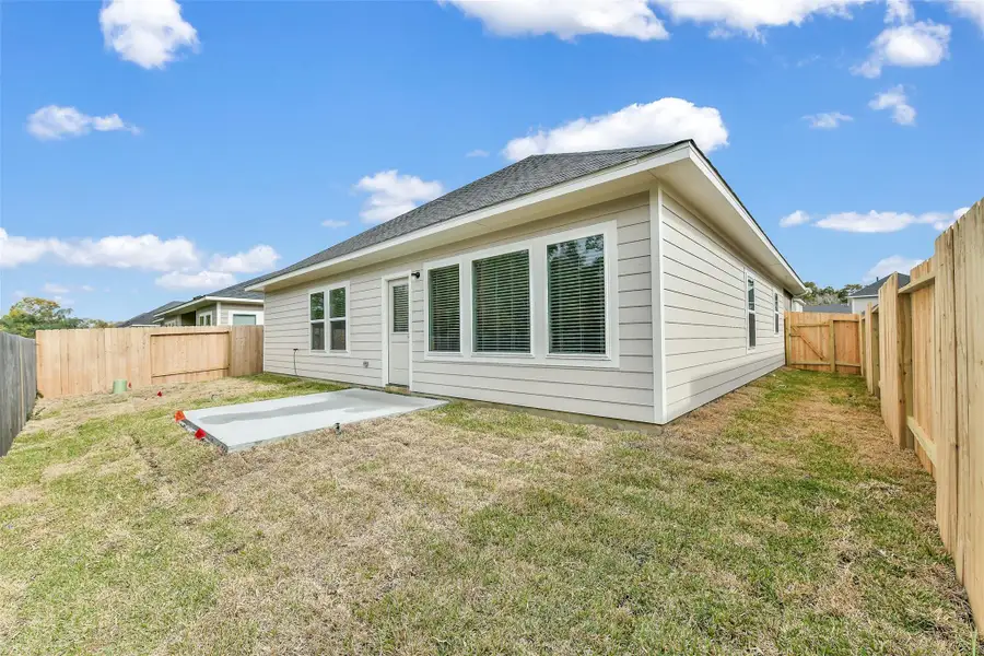 Exterior details and patio area of a home in King Oaks Village, Baytown (Image 3).