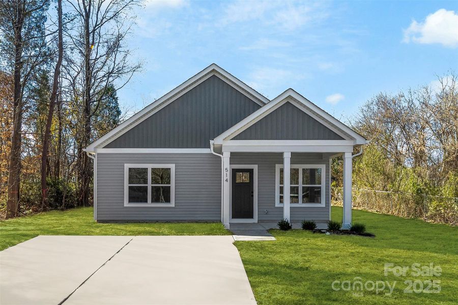 Front exterior of a new home in , East Spencer, NC, highlighting curb appeal (Image 1).