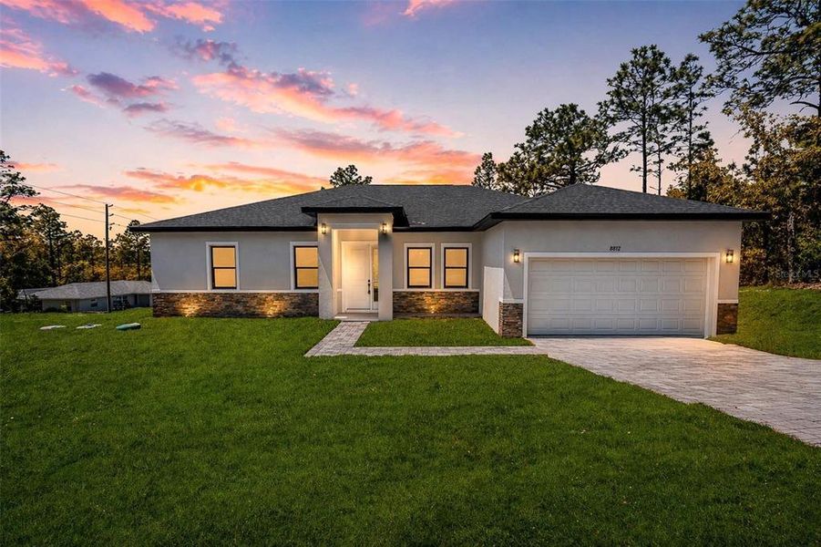 Front exterior of a new home in , Citrus Springs, FL, highlighting curb appeal (Image 23).