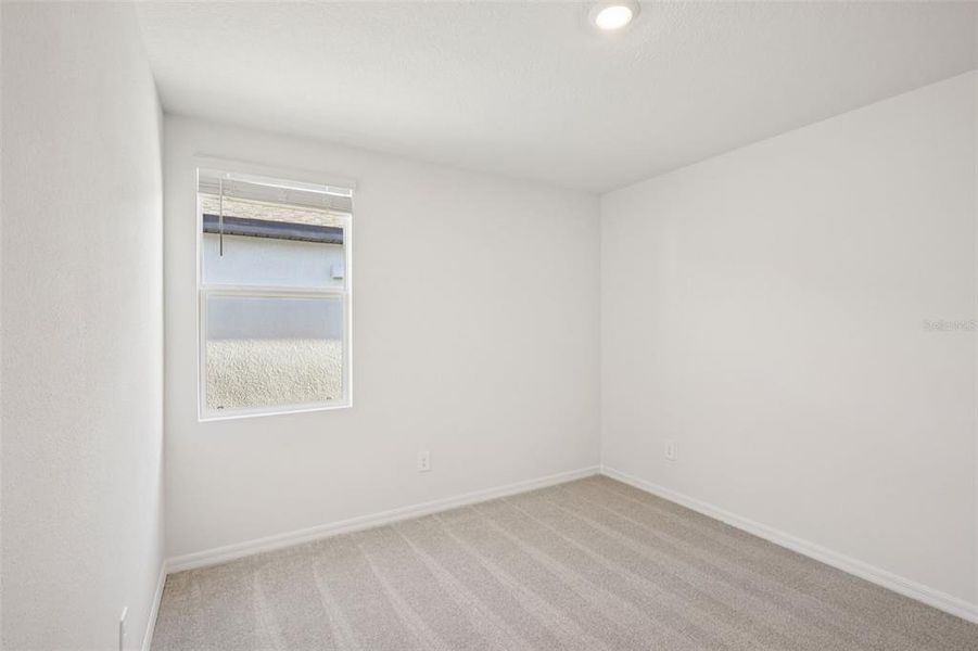 Spacious, unfurnished interior of a new home in The Grove at Stuart Crossing - Classic Series, Bartow (Image 16).