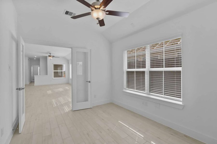 Representative unfurnished interior of a home built from the Chalet by Chesmar Homes in Meridiana Townhomes, Iowa Colony (Image 31).