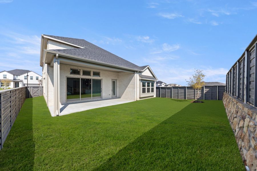Exterior details and patio area of a home in Discovery Collection at Union Park, Little Elm (Image 17).