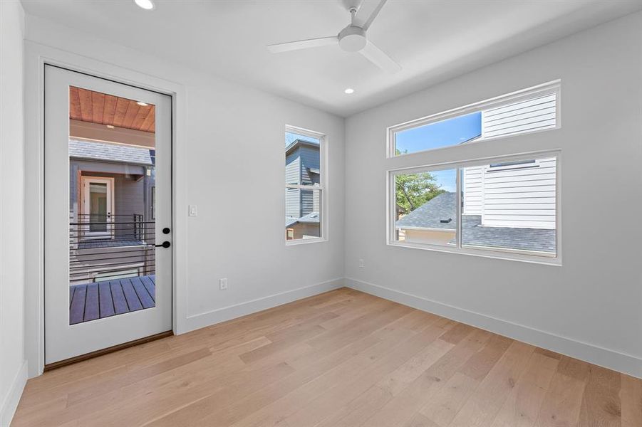 Primary bedroom with private balcony.