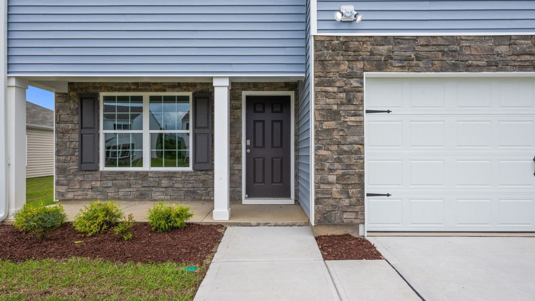 Front exterior of a new home in Madeline Farm, New Bern, NC, highlighting curb appeal (Image 14).