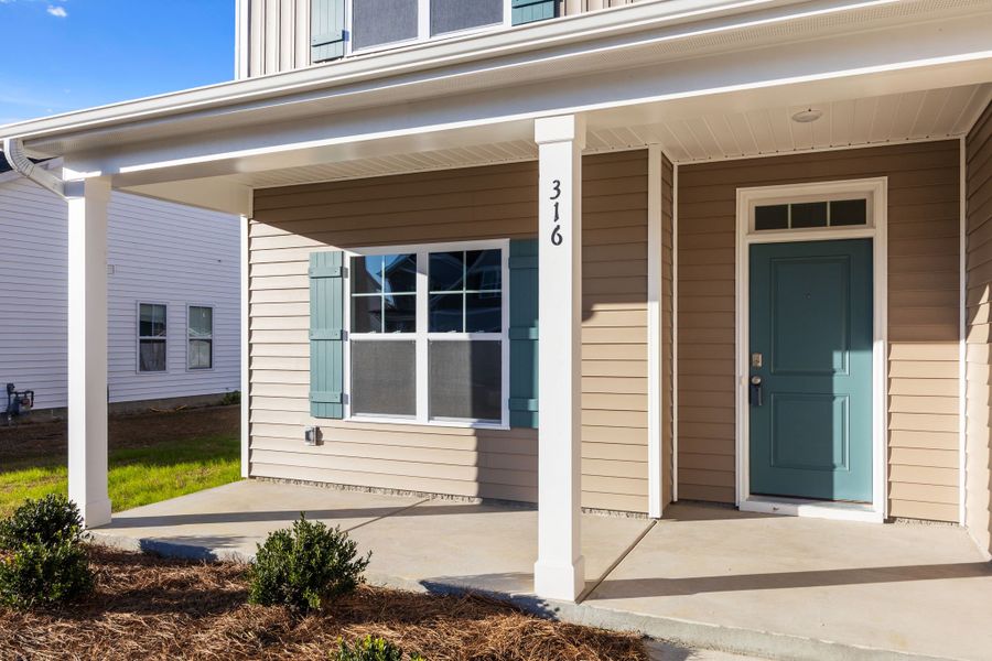 Exterior details and patio area of a home in Arbor Hills South II, Greenville (Image 24).