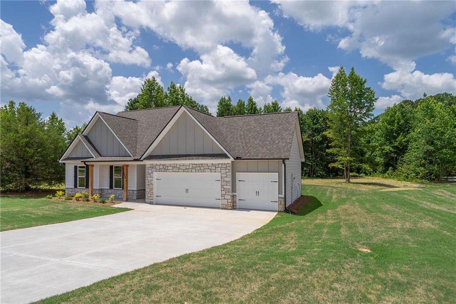 Front exterior of a new home in , Good Hope, GA, highlighting curb appeal (Image 1). Front exterior of a new home in , Good Hope, GA, highlighting curb appeal (Image 1).