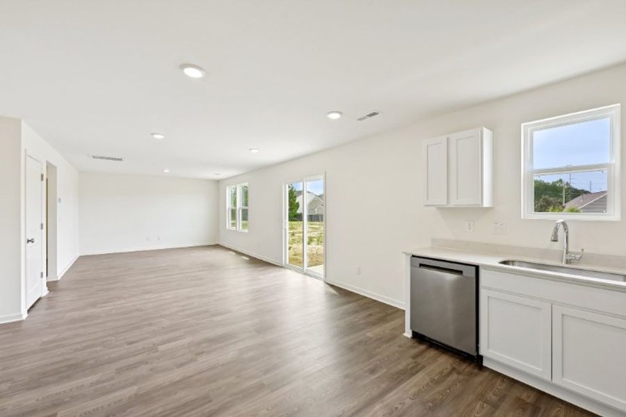 A kitchen with white cabinets. A kitchen with white cabinets.