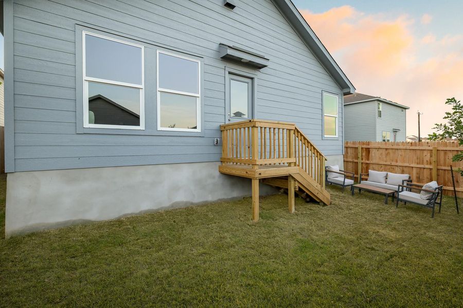 Rear view of property featuring an outdoor living space Rear view of property featuring an outdoor living space