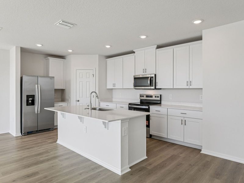 Furnished interior view inside a new home in Lake Deer Estates - Signature Series, Poinciana (Image 4).