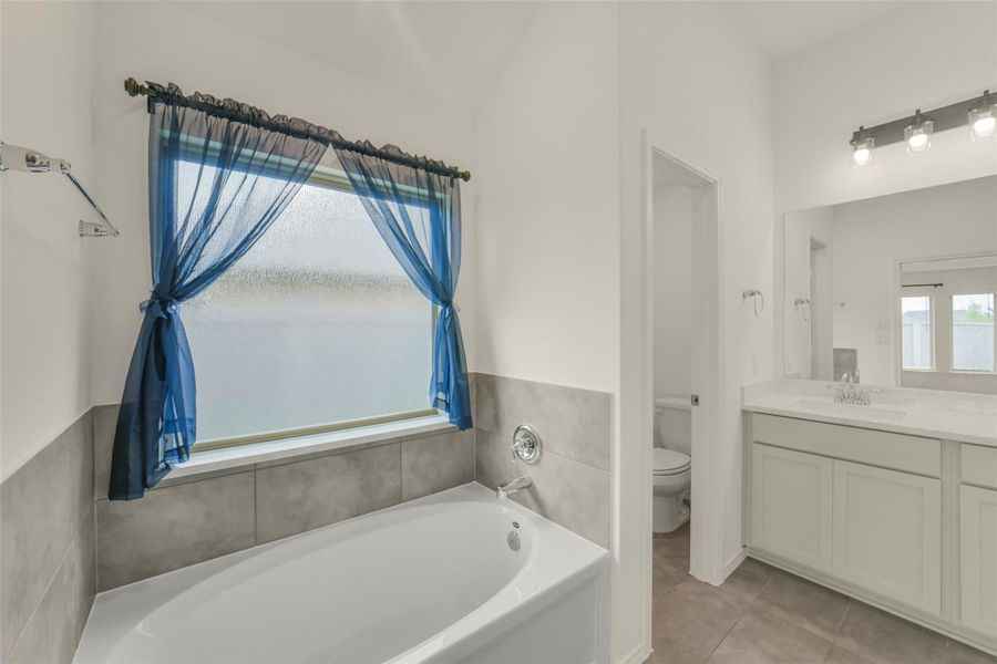 Furnished interior view inside a new home in Bridgeland, Cypress (Image 12).