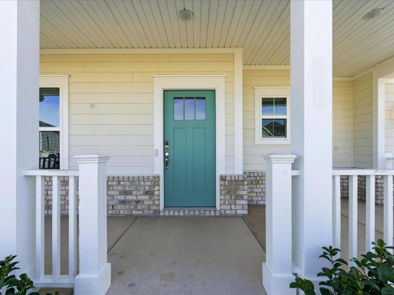 Exterior details and patio area of a home in The Coves at Lakes of Cane Bay II, Summerville (Image 25).