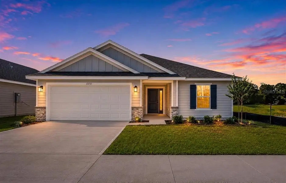 Front exterior of a new home in Briarwood, Alachua, FL, highlighting curb appeal (Image 2). Front exterior of a new home in Briarwood, Alachua, FL, highlighting curb appeal (Image 2).