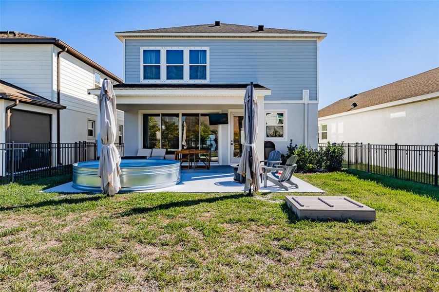 Exterior details and patio area of a home in Waterset Garden Series, Apollo Beach (Image 29).