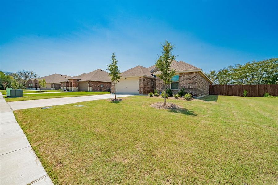 Front exterior of a new home in , Kaufman, TX, highlighting curb appeal (Image 23). Front exterior of a new home in , Kaufman, TX, highlighting curb appeal (Image 23).