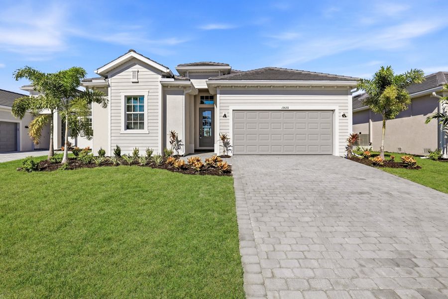 Front exterior of a new home in Sandy Key, Fort Myers, FL, highlighting curb appeal (Image 1). Front exterior of a new home in Sandy Key, Fort Myers, FL, highlighting curb appeal (Image 1).