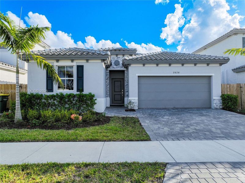 Front exterior of a new home in , Homestead, FL, highlighting curb appeal (Image 28). Front exterior of a new home in , Homestead, FL, highlighting curb appeal (Image 28).