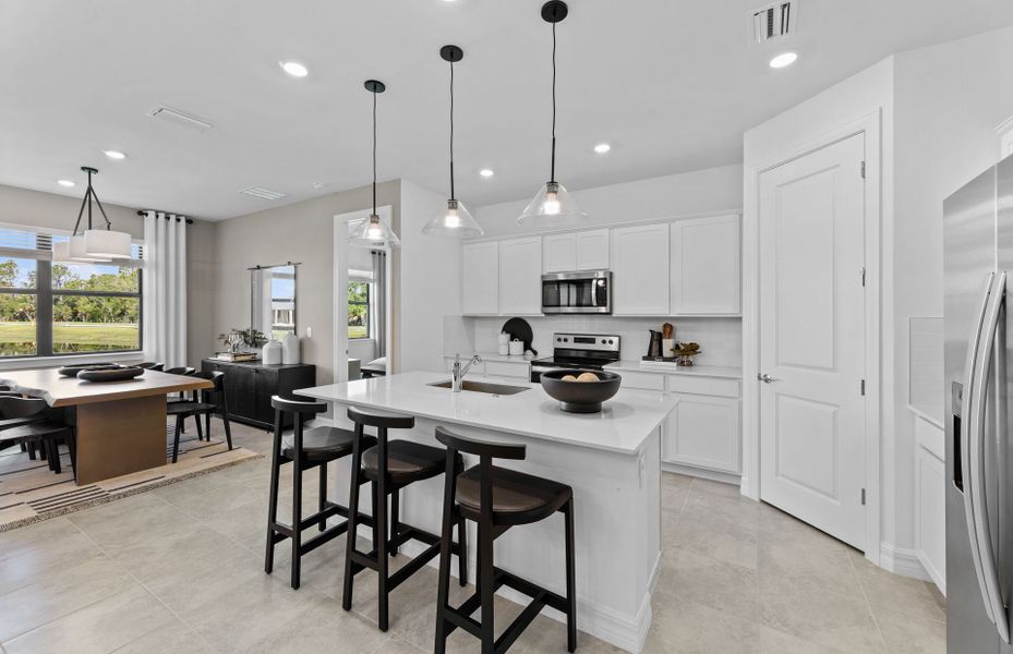 Kitchen with white cabinets and quartz countertops Kitchen with white cabinets and quartz countertops