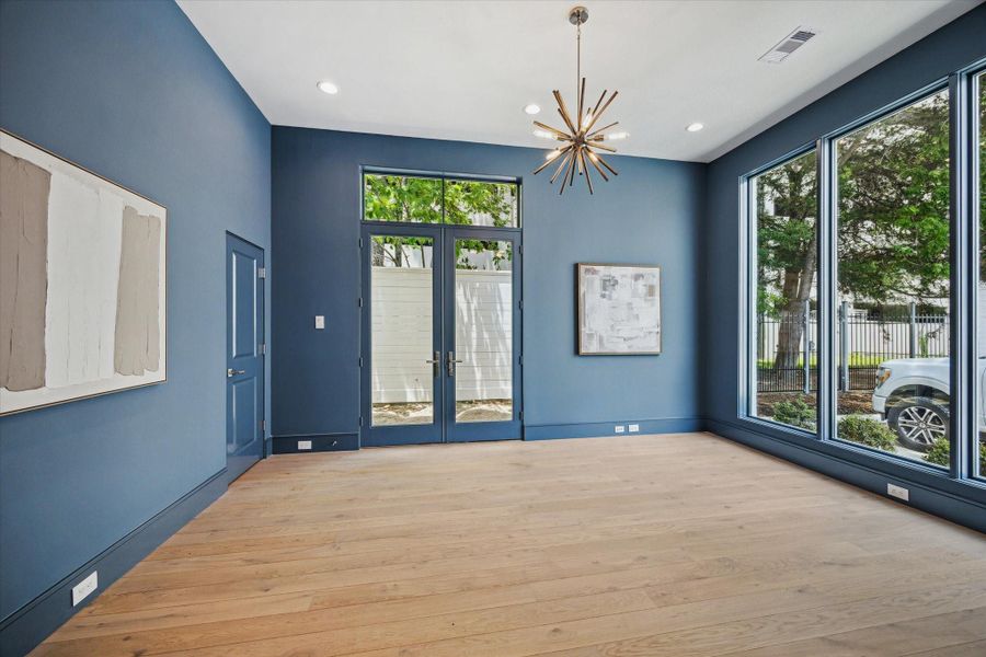 Off the entry is the dedicated office or formal dining. French doors open to side yard that connects to back yard, which maximizes usability or outdoor areas.