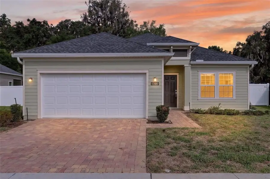Front exterior of a new home in Heath Preserve, Ocala, FL, highlighting curb appeal (Image 22).