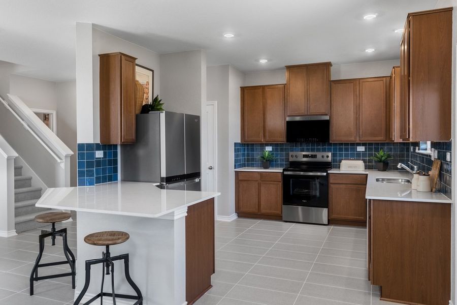 Representative furnished interior of a home built from the 1676 Modeled by KB Home in Nagel Crossing, San Antonio (Image 7).