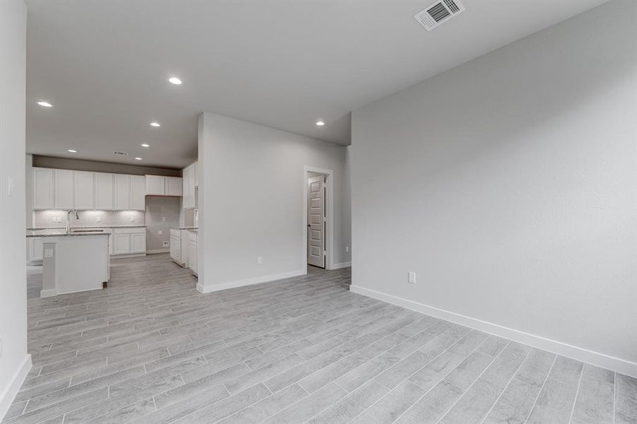 Another view of the dining room. Sample photo of completed home with similar floor plan. As-built interior colors and selections may vary.