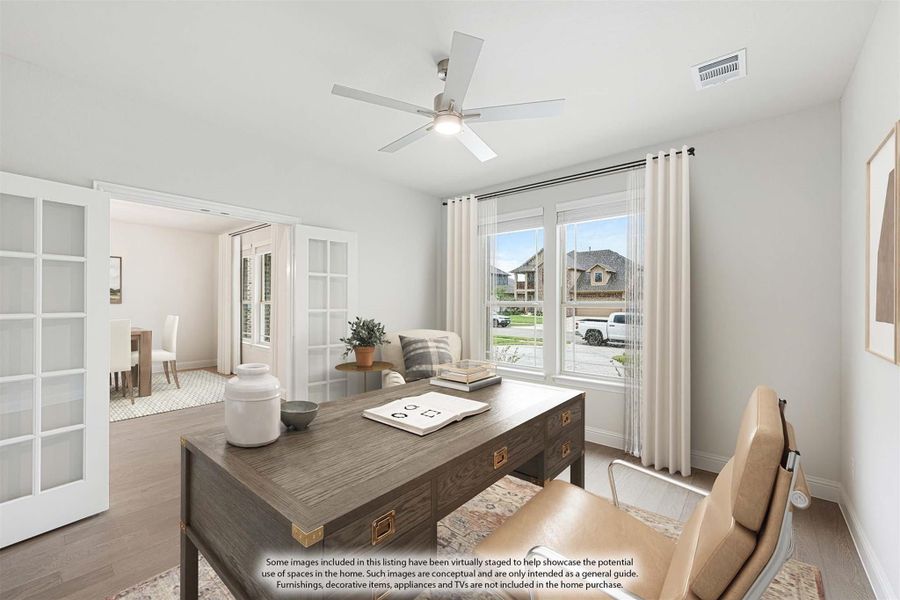 Home office with wood desk, ceiling fan, and French doors opening to adjacent room Home office with wood desk, ceiling fan, and French doors opening to adjacent room