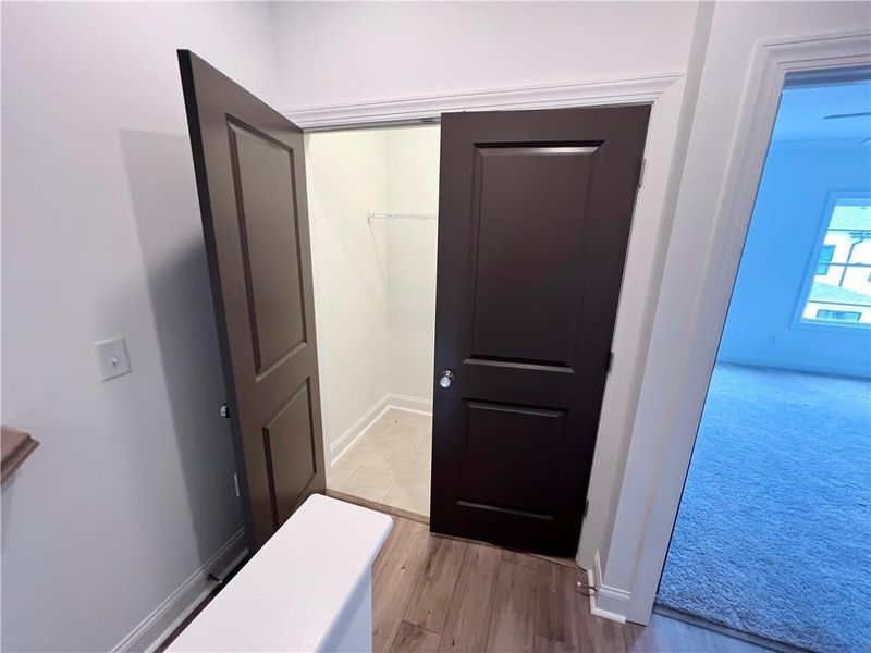 Laundry Room on top level next to owners and secondary bedroom