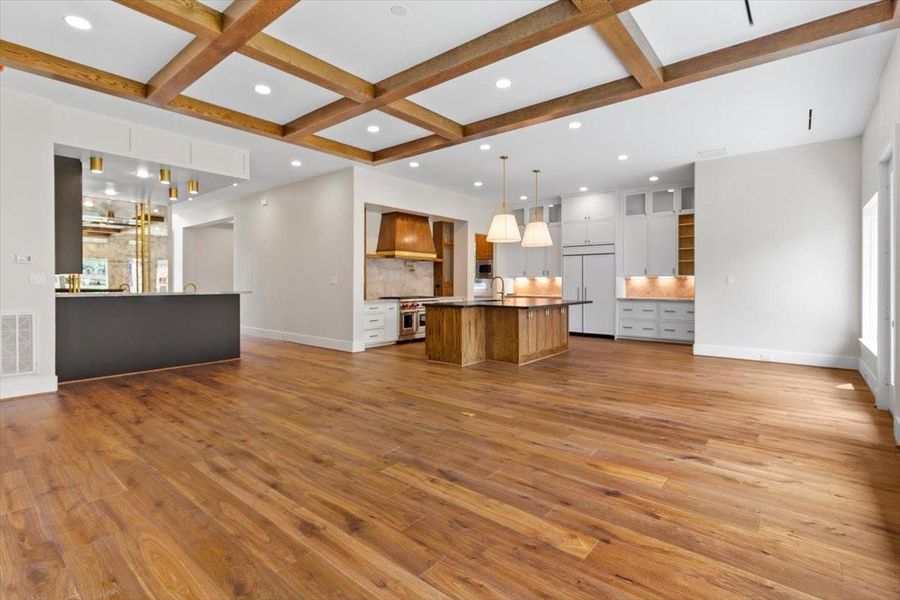 The kitchen, family room, wet bar, breakfast area, moms office anchor this space for seamless flow