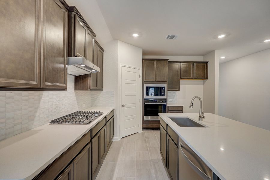 Kitchen in the Oleander floorplan at a Meritage Homes community.