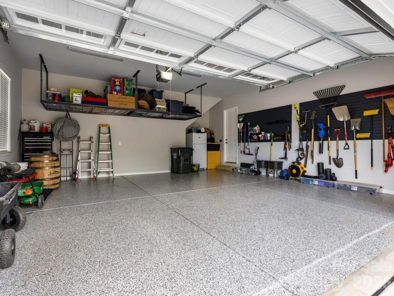 2-car, epoxy floor, double slatwall for tools, overhead storage. Interior door leads to dropzone