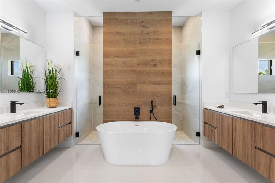 PRIMARY SUITE with SPA-STYLE BATH featuring a FREESTANDING SOAKING TUB
