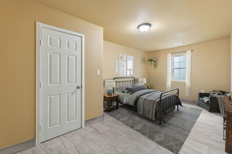 Bedroom with marble finish floor and visible vents Bedroom with marble finish floor and visible vents
