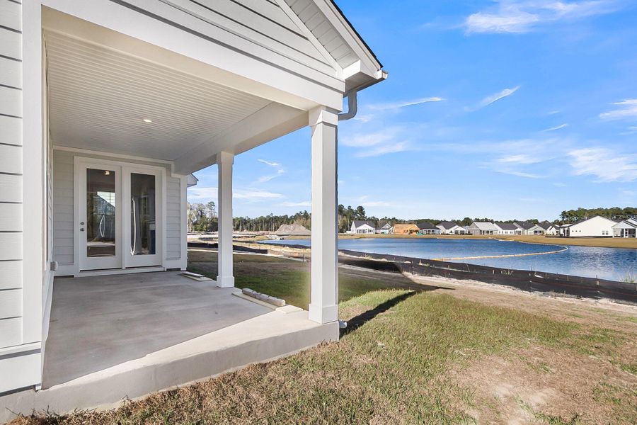 Exterior details and patio area of a home in Tidewater at Lakes of Cane Bay, Summerville (Image 2).
