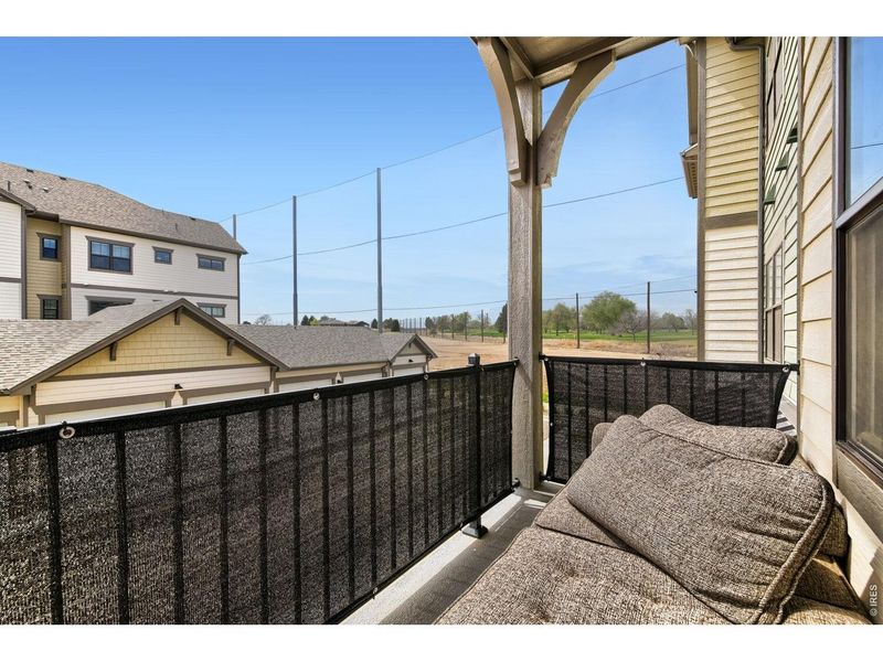 Exterior details and patio area of a home in Highlands at Fox Hill - The Flats, Longmont (Image 24).