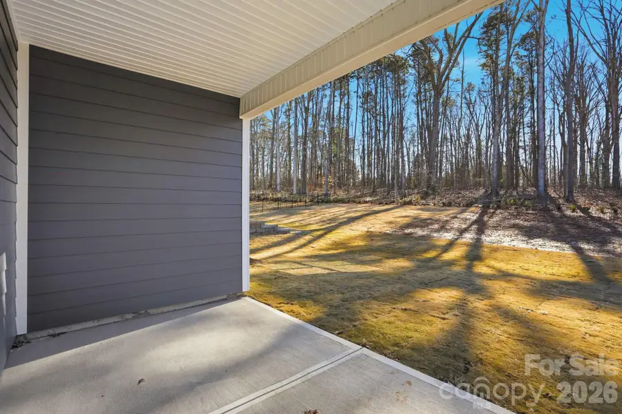 Exterior details and patio area of a home in Villas at Prestwick, Mooresville (Image 4).
