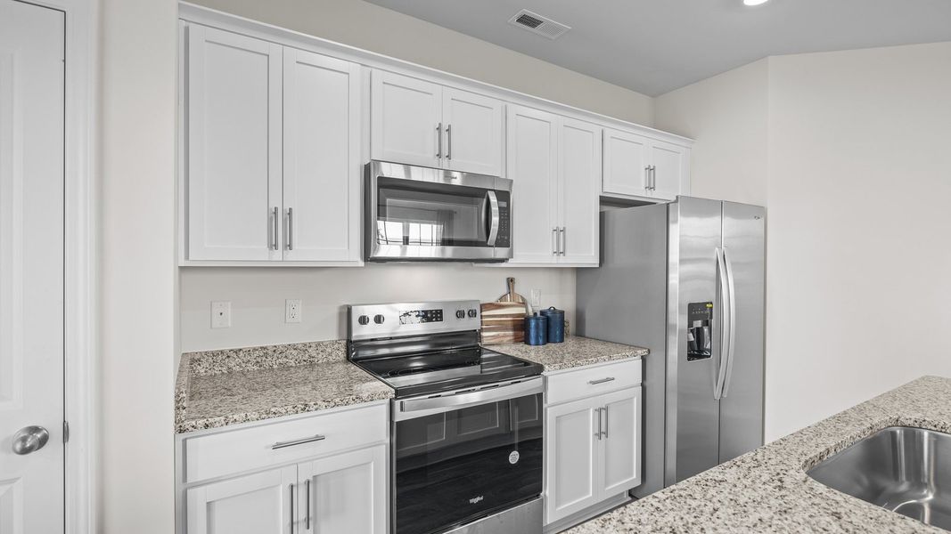 Furnished interior view inside a new home in The Townes at Ridgewood Farms, Winterville (Image 8).
