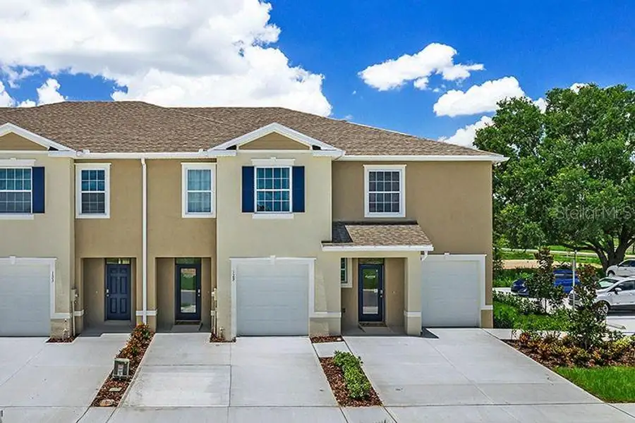 Front exterior of a new home in Preston Cove, St. Cloud, FL, highlighting curb appeal (Image 1). Front exterior of a new home in Preston Cove, St. Cloud, FL, highlighting curb appeal (Image 1).