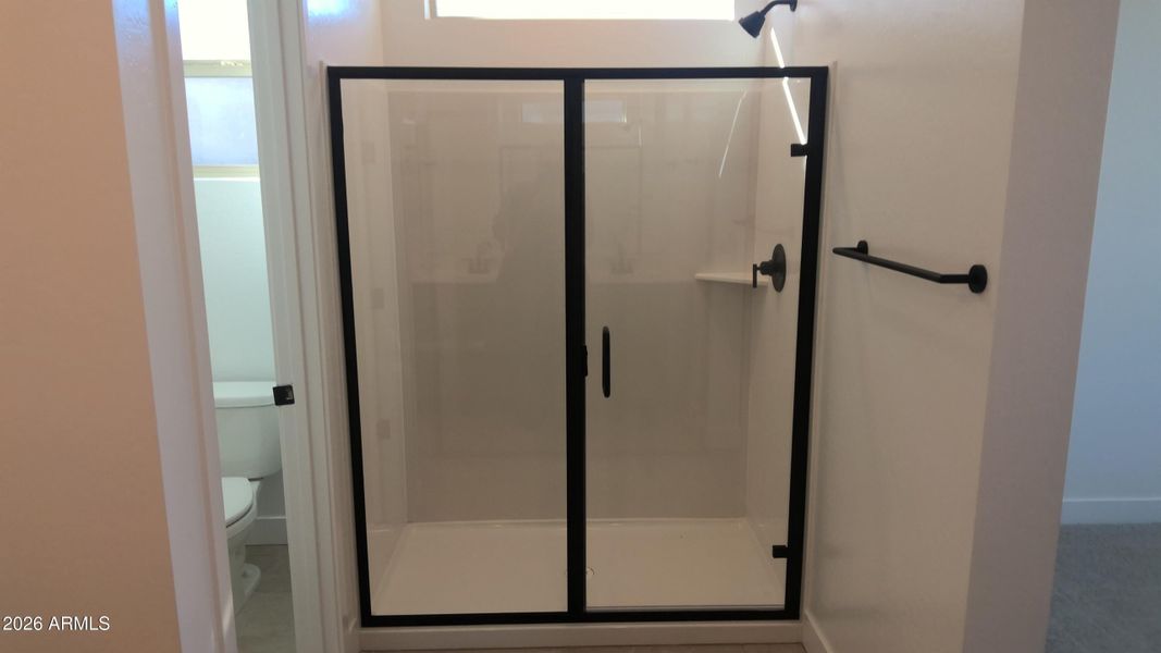 Masterbath shower with matte black trim