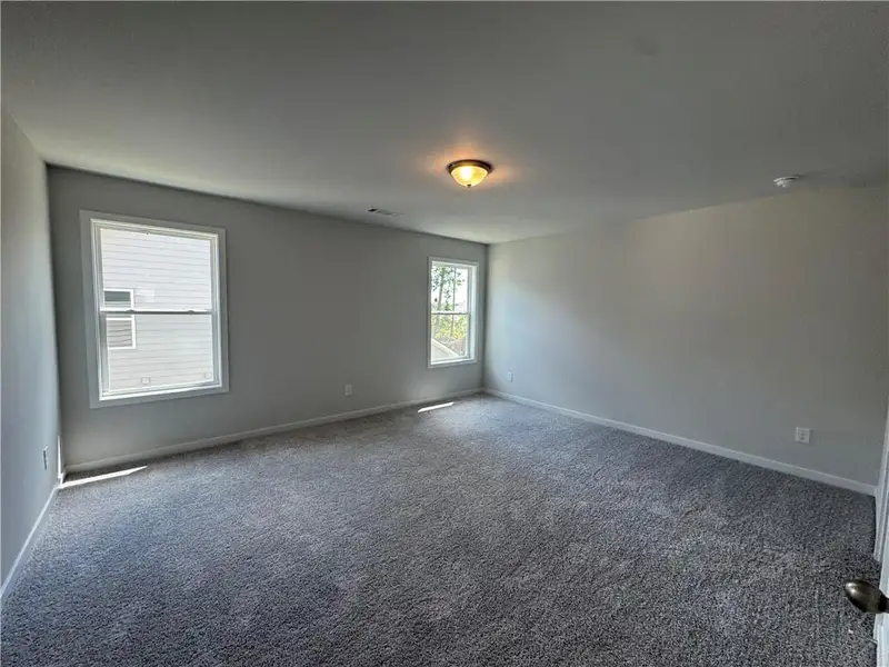 Spacious, unfurnished interior of a new home in Rosewood Lake Preserve, Hoschton (Image 19).