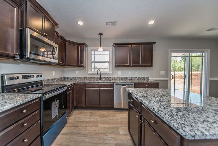 Representative furnished interior of a home built from the Archer by Enchanted Homes in Lonesome Dove, San Antonio (Image 12).