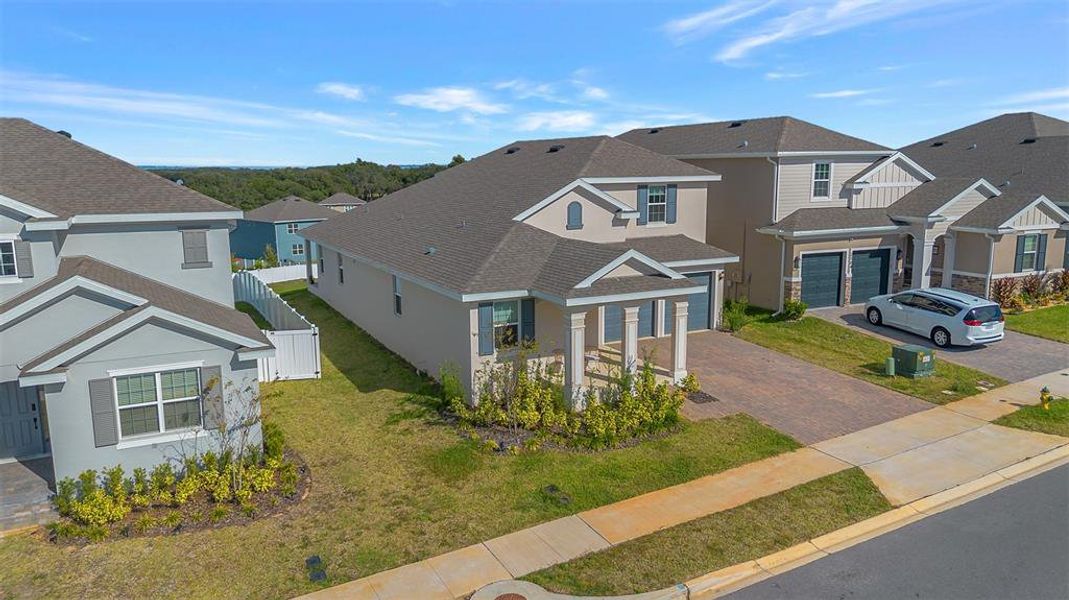Front exterior of a new home in , Minneola, FL, highlighting curb appeal (Image 2). Front exterior of a new home in , Minneola, FL, highlighting curb appeal (Image 2).