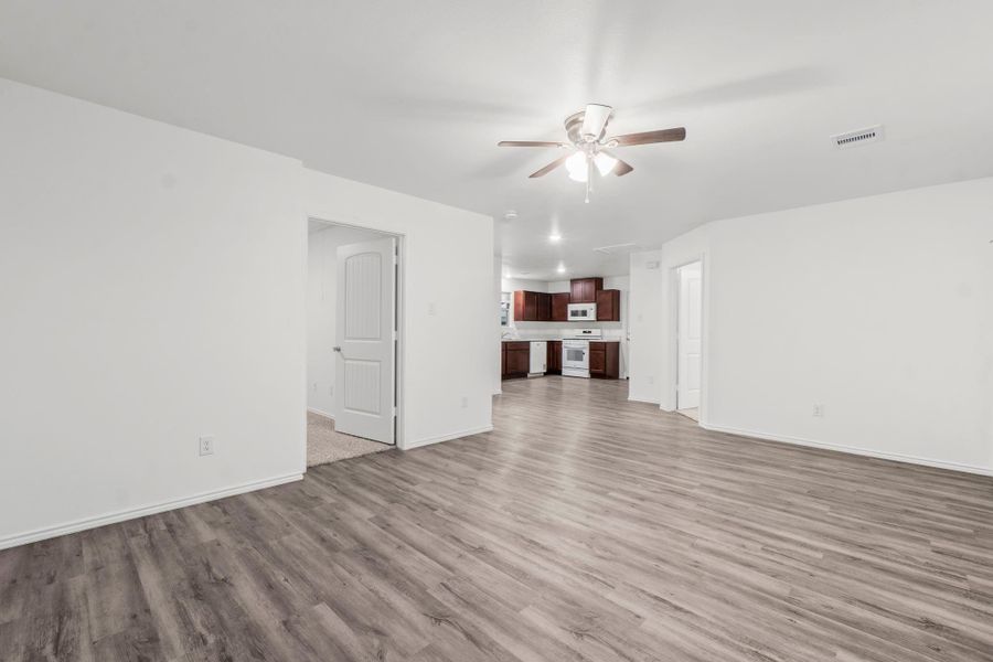 View from the living space looking into the bedrooms and kitchen. View from the living space looking into the bedrooms and kitchen.