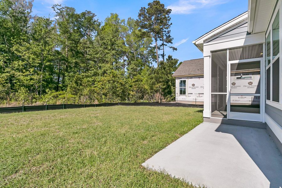 Front exterior of a new home in Tidewater at Lakes of Cane Bay, Summerville, SC, highlighting curb appeal (Image 19). Front exterior of a new home in Tidewater at Lakes of Cane Bay, Summerville, SC, highlighting curb appeal (Image 19).