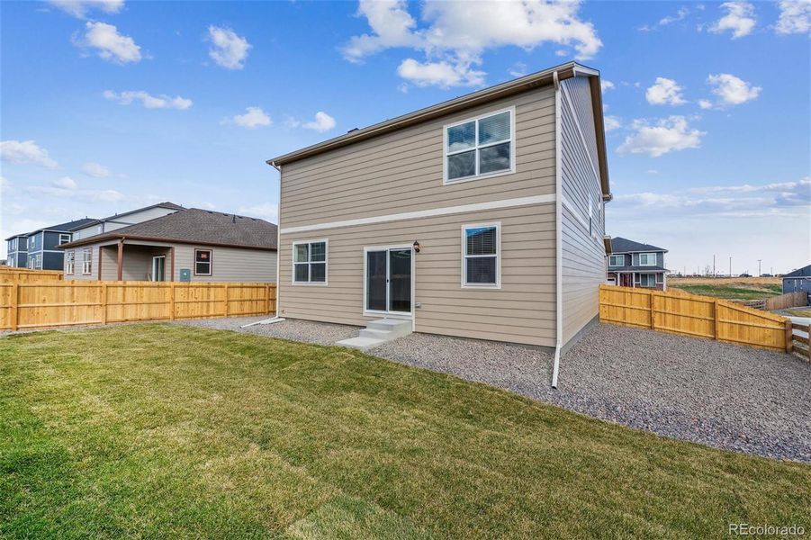 Front exterior of a new home in Spring Valley Ranch, Elizabeth, CO, highlighting curb appeal (Image 2).