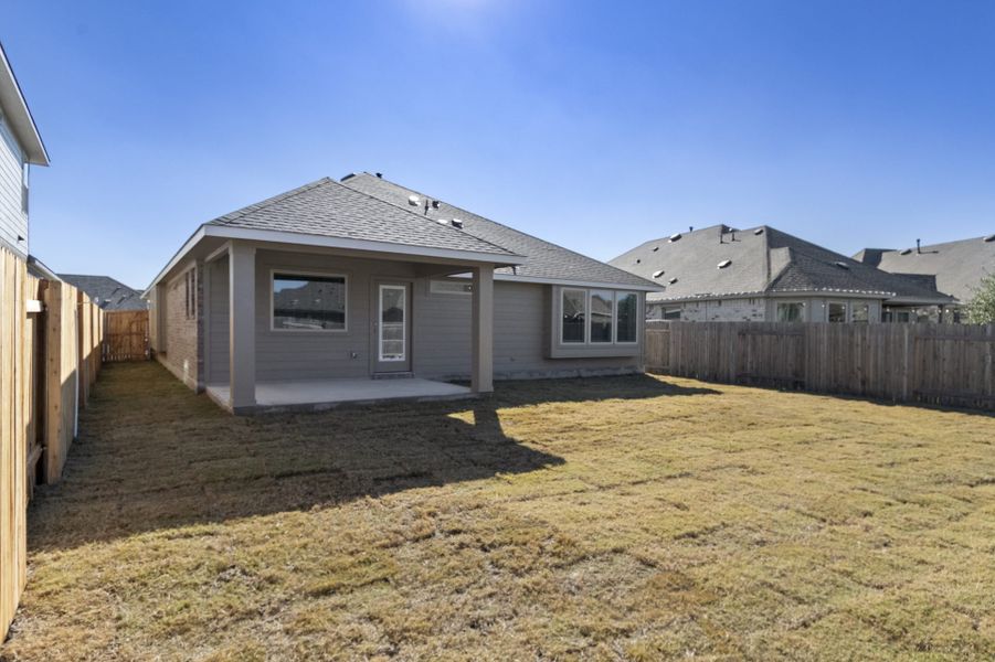 Exterior details and patio area of a home in Crosswinds, Kyle (Image 20).
