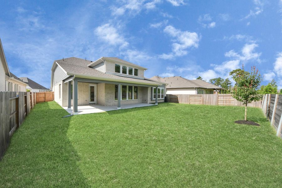 Front exterior of a new home in ARTAVIA: Hilltop Collection, Conroe, TX, highlighting curb appeal (Image 18). Front exterior of a new home in ARTAVIA: Hilltop Collection, Conroe, TX, highlighting curb appeal (Image 18).