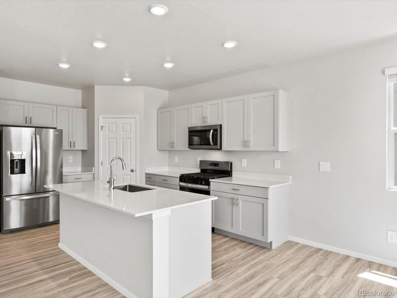 Furnished interior view inside a new home in Ridgeline Vista: The Canyon Collection, Brighton (Image 8).