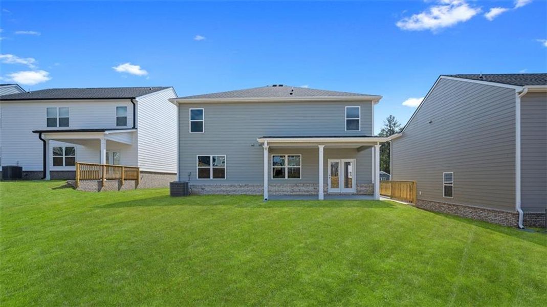 Exterior details and patio area of a home in Twin Lakes, Hoschton (Image 4).