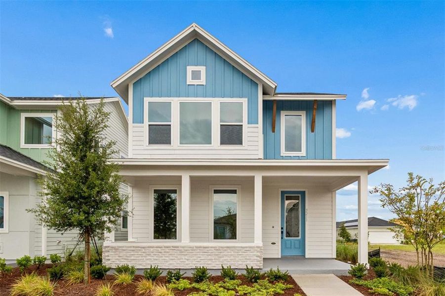 Front exterior of a new home in Weslyn Park in Sunbridge 34', St. Cloud, FL, highlighting curb appeal (Image 2). Front exterior of a new home in Weslyn Park in Sunbridge 34', St. Cloud, FL, highlighting curb appeal (Image 2).