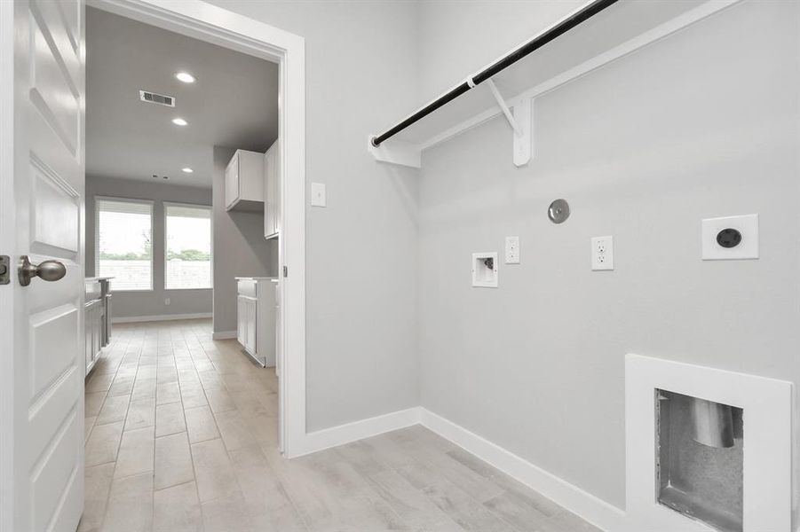 Utility room on 1st floor. Both electric and gas dryer connections.